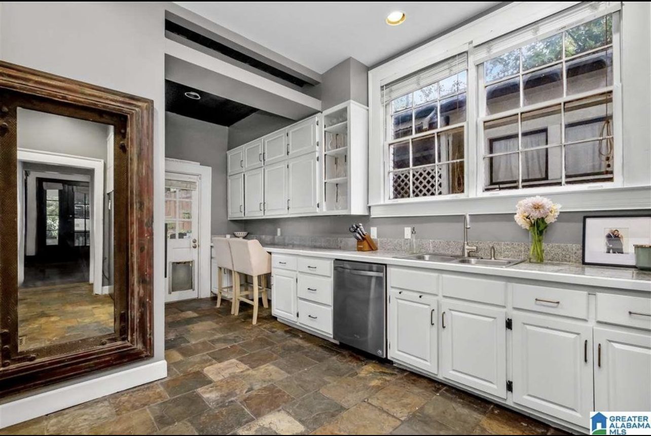 Birmingham kitchen — alternate before angle showing the original counter run and slate floor
