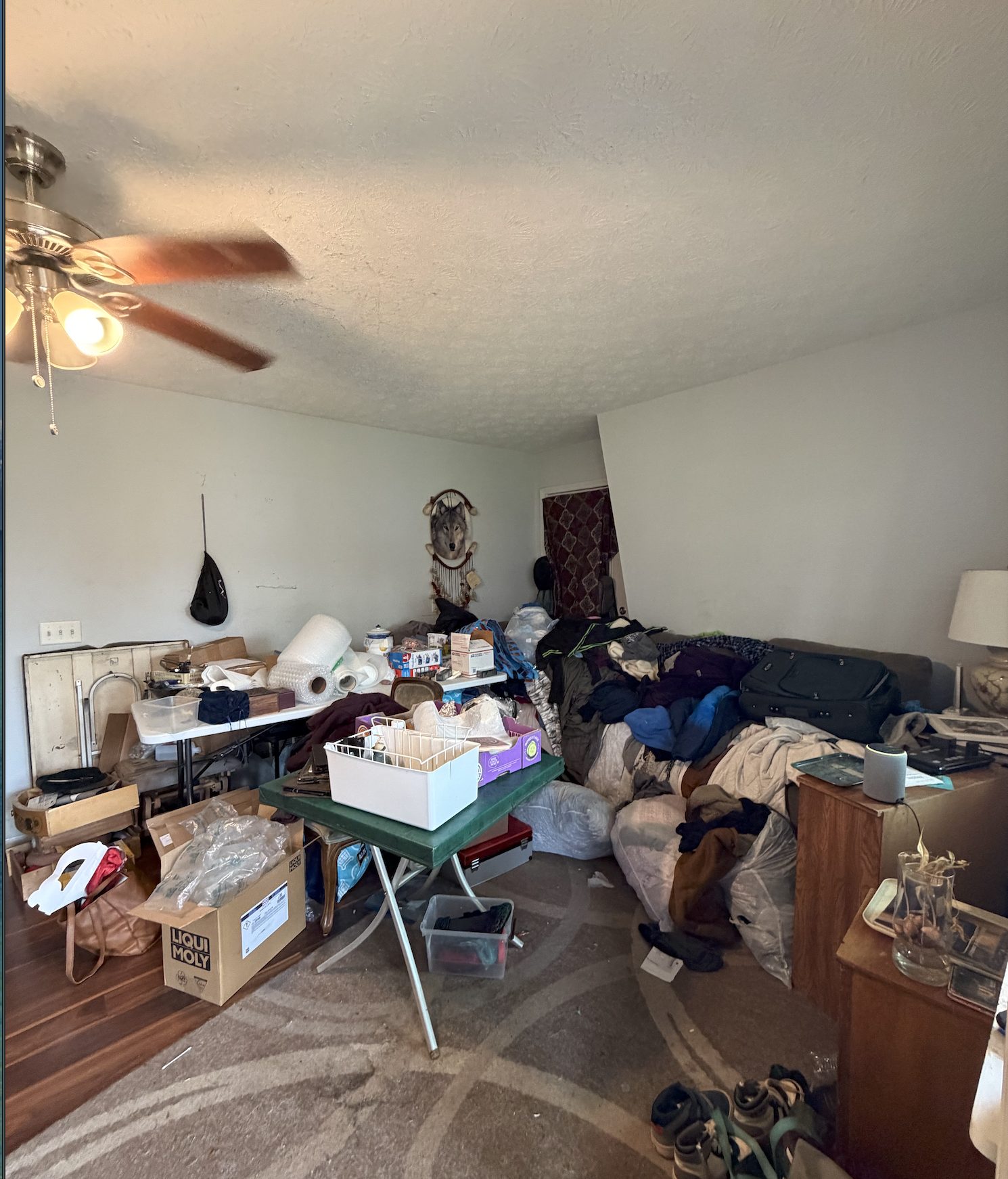 Lanier — before interior of the upstairs bedroom showing the original ceiling fan and finishes